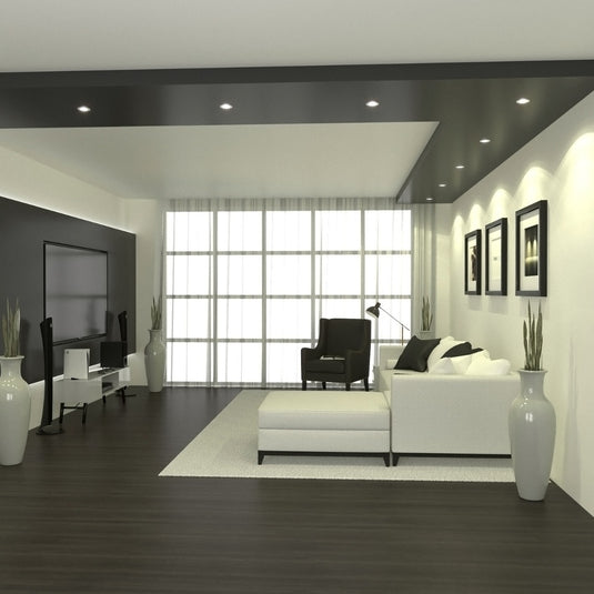 downlights in a living room with a white sofa and a TV