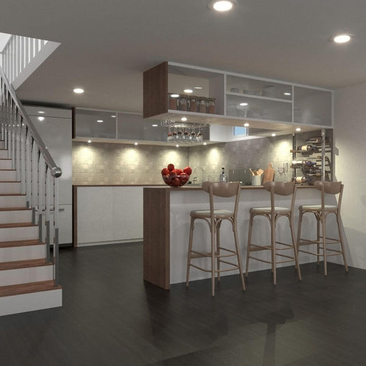kitchen with bar stools and surface mounted under cabinet light in warm white light