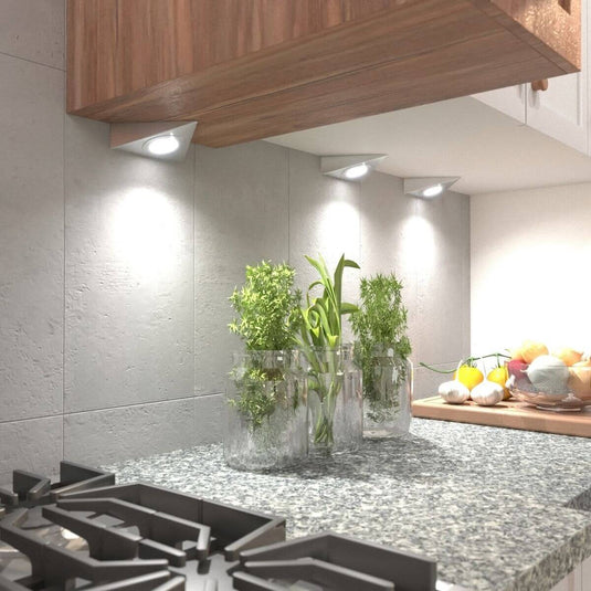 mid close up of mounted triangle under cabinet lights with natural white light