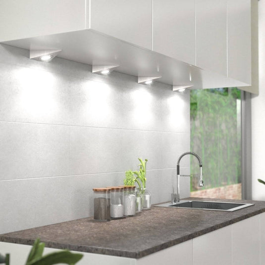 mounted triangle under cabinet light with natural white light under a kitchen cabinet