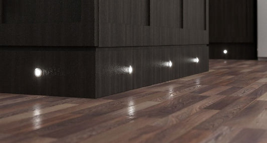 Dark brown cabinets with plinth lights