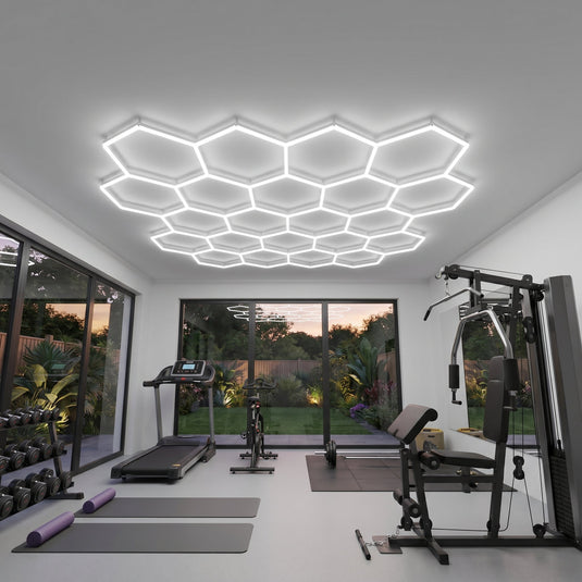22 hexagon LED lights on the ceiling of a home gym