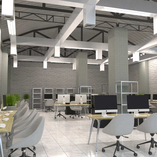Office desks under LED battens, side view