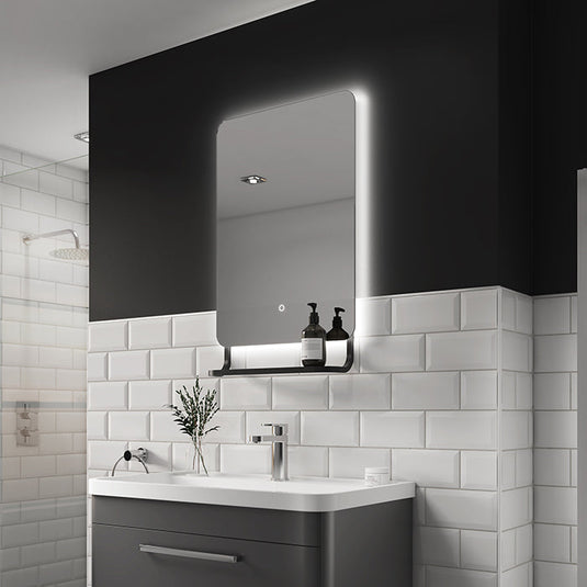 Harbour LED mirror lit above a basin in a tiled bathroom