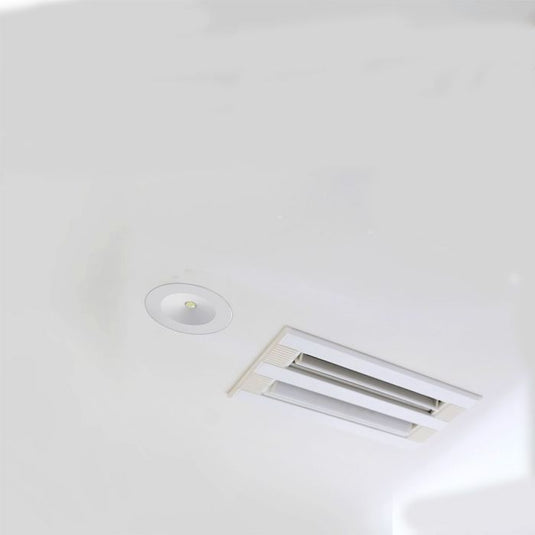 Emergency downlight fitted in a ceiling