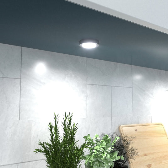 Single surface mount under cabinet light lit natural white