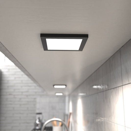 Kitchen counter lit by natural white cabinet lights