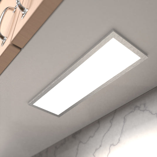 Close up of a cabinet light under a kitchen cabinet