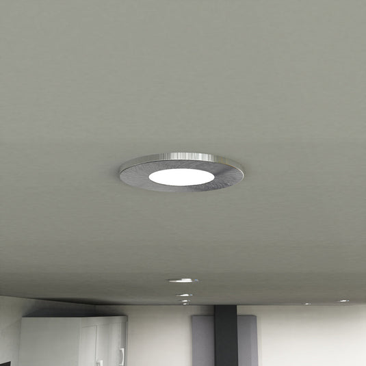Close up of a fitted satin nickel downlight
