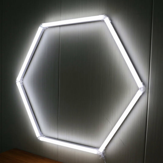 Single hexagon LED light lit on a wall