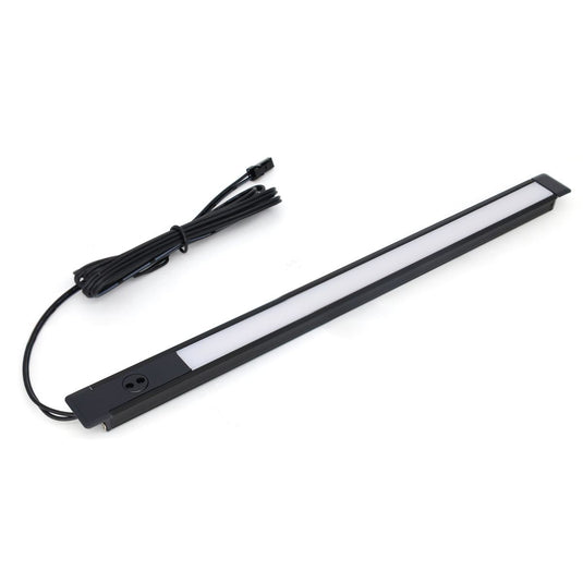 Recessed profile with a sensor and cable on a white surface