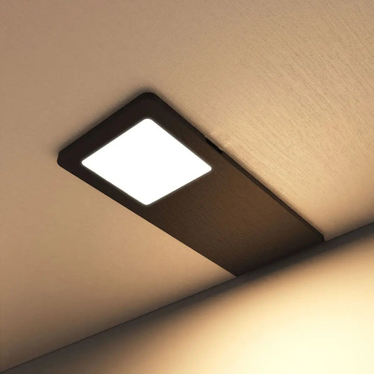 Black Recti Superslim 5w LED Cabinet Light, mounted under cabinet in warm white light