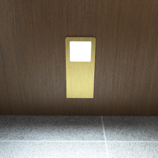 Cool white brushed brass cabinet light, close view