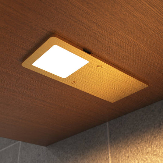 Fitted brass cabinet light in warm white