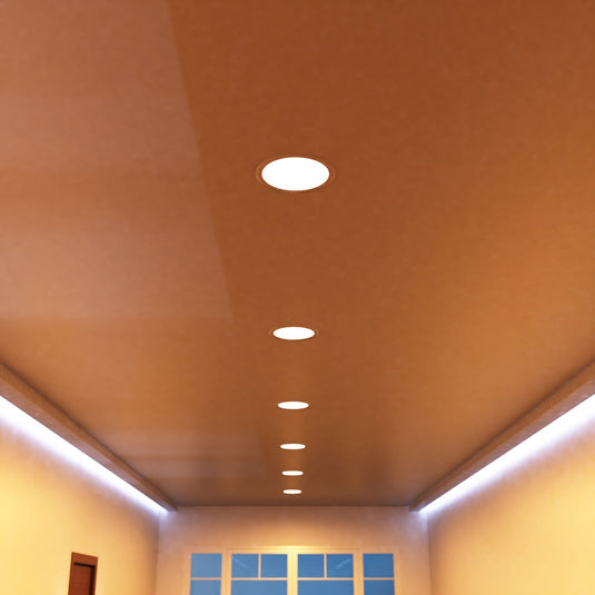Close view of a warm white round panel in a ceiling