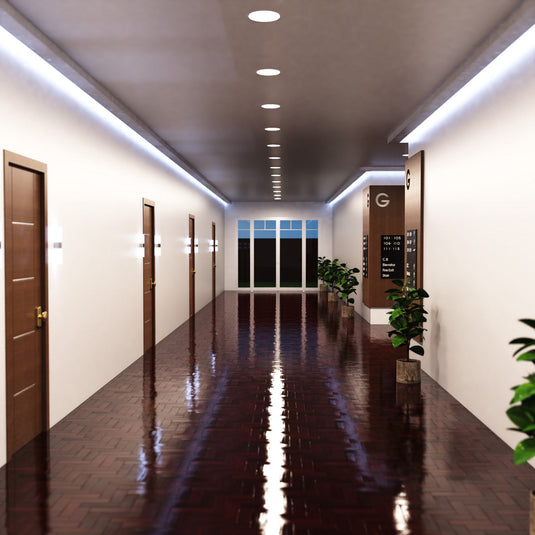 Hallway lit by natural white round panels