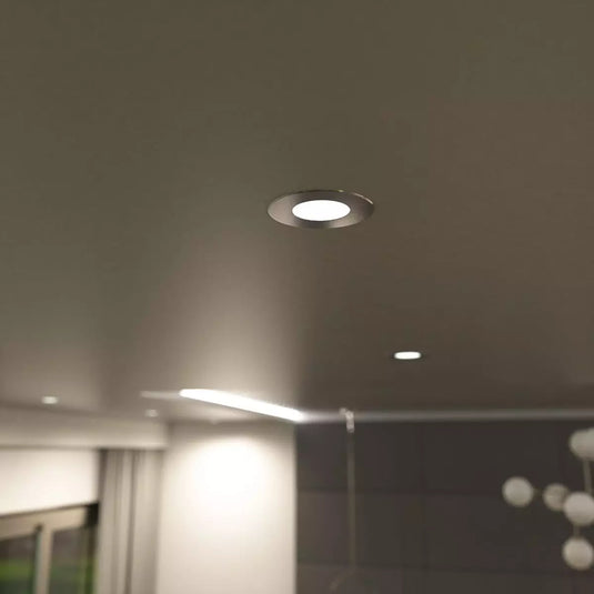 Fire Rated Downlight - Brushed Chrome in natural white light mounted in ceiling