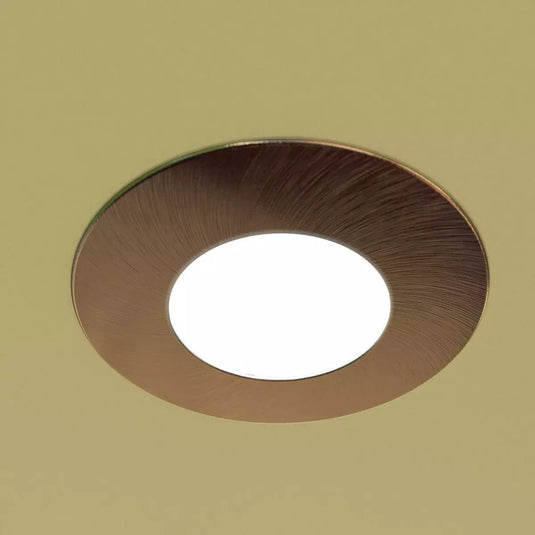 Fire Rated Downlight - Brushed Chrome in warm white light