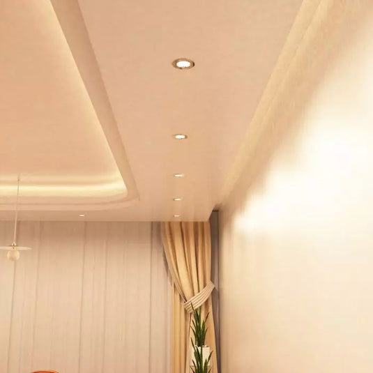 Chrome GU10 Fire Rated Downlight in warm white light dining ceiling setting