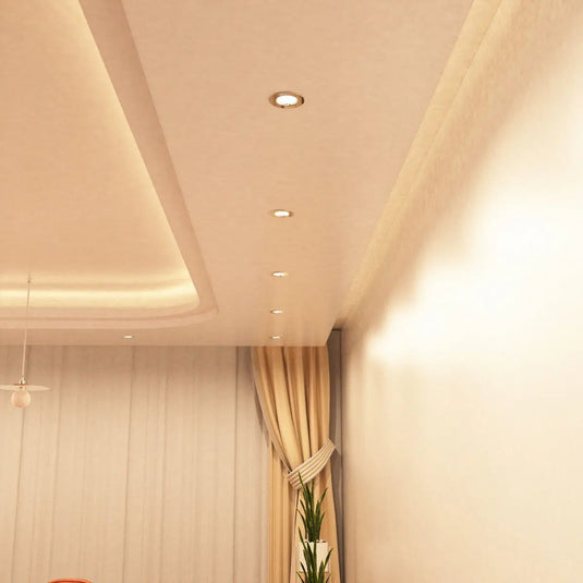 Fire Rated Downlight, GU10, Fixed - Polished Chrome in warm white light dining room setting mounted in ceiling