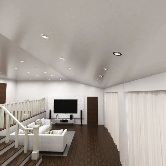 Chrome, Tilt, Fire Rated GU10 Downlight in cool white light in aerial view of living room