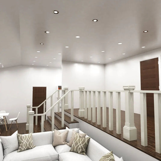 Chrome, Tilt, Fire Rated GU10 Downlight in cool white light in living room setting