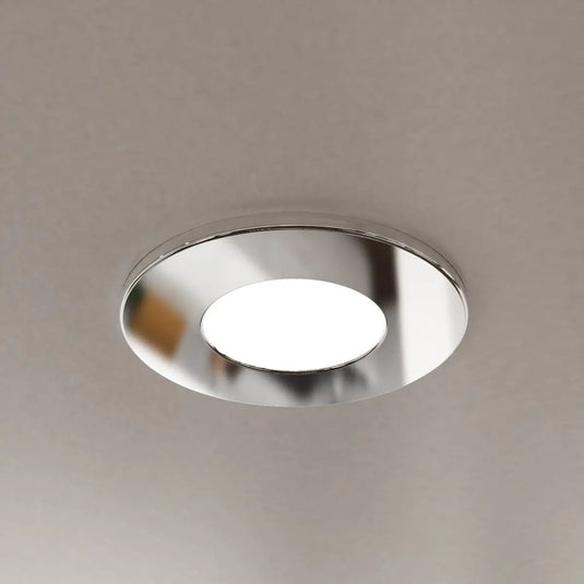 Chrome GU10 Downlight in cool white light mounted in the ceiling