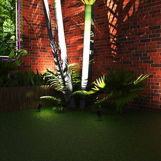 Spike lights aimed at a tree in a garden