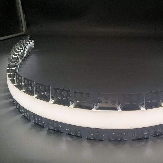 Profile and diffuser bent into a curve with strip inside