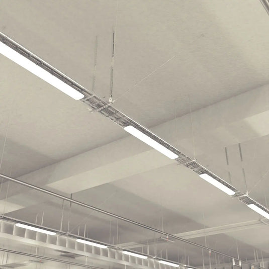 NCF IP65 LED Batten with Microwave Sensor in natural white light suspended on the ceiling