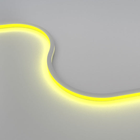 RGB neon flex glowing yellow in an S curve