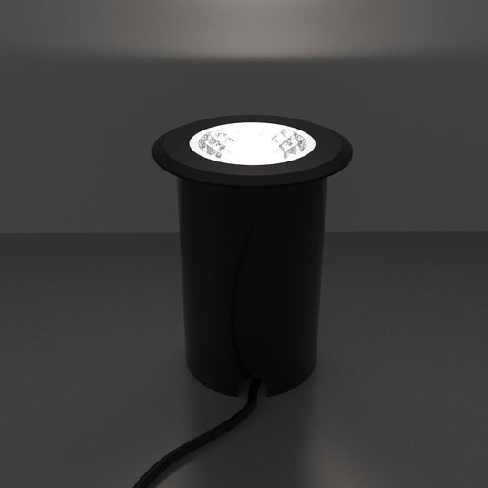 Close up of a lit black ground light