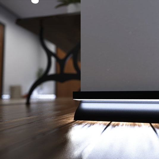 Close up of black skirting profile lit in cool white