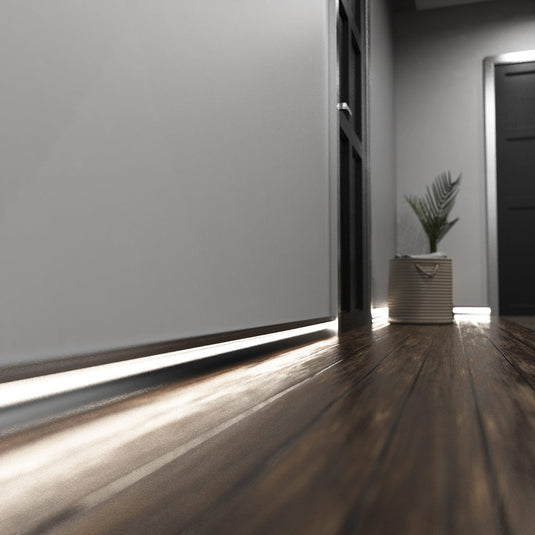 Hallway with silver skirting profile lit in natural white
