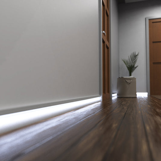 Hallway with white skirting profile lit in cool white