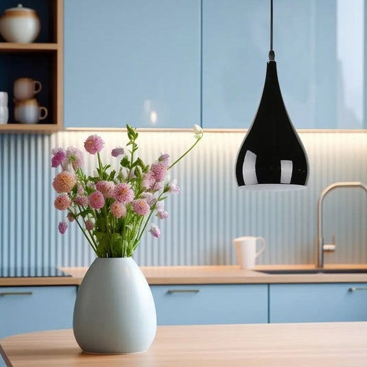 Black Teardrop LED Pendant Light hanging on top of the kitchen counter setting