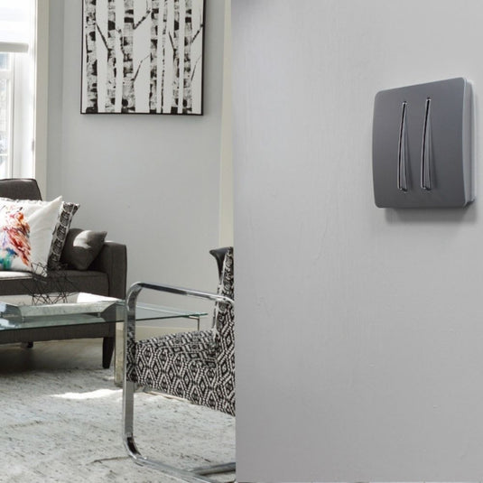 Silver 2 gang light switch fitted to a wall