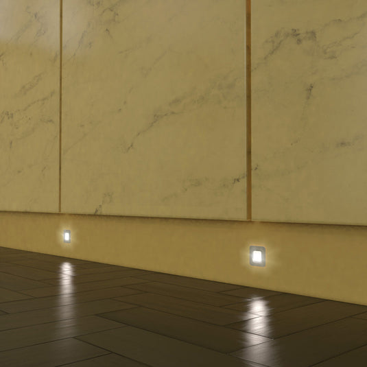 Natural white plinth lights lighting the floor below units