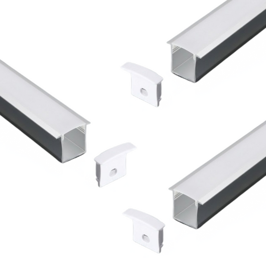 Three recessed silver LED profiles with milky diffusers and end caps