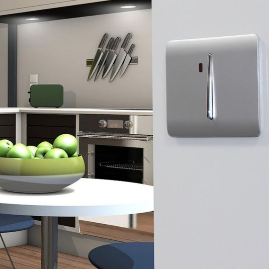 Silver 20A switch fitted to a wall
