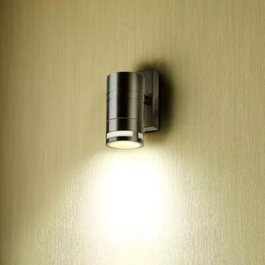 stainless steel wall light fitting on a wall