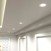 short can downlights in white installed on a ceiling with a cool white light