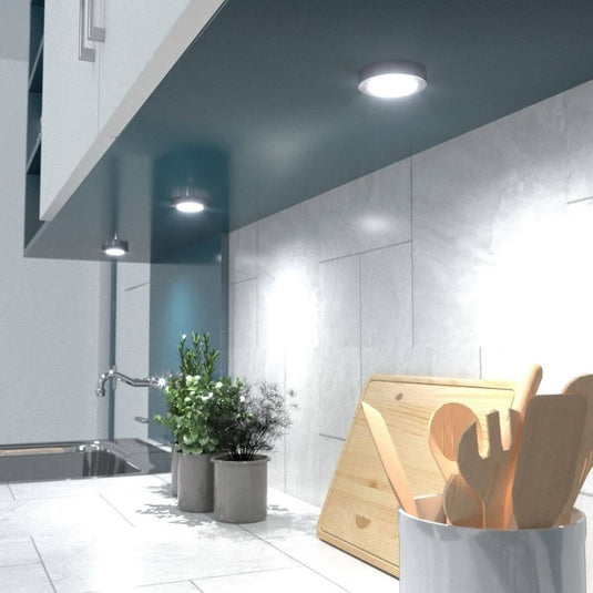 kitchen counter with surface mounted under cabinet lights in natural white light