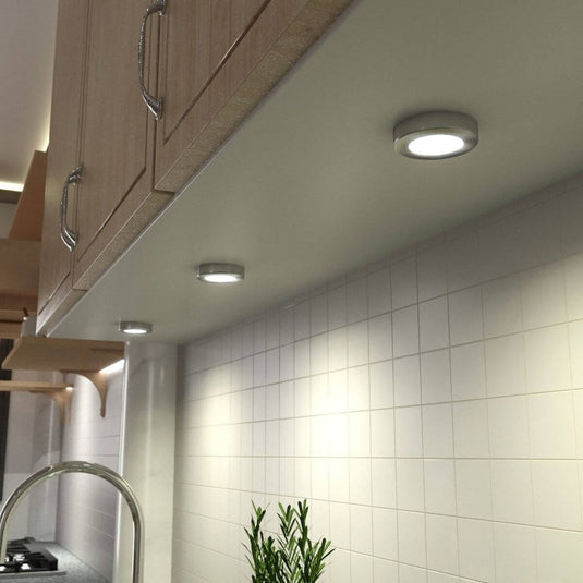 Under cabinet lights in brushed chrome with warm white light