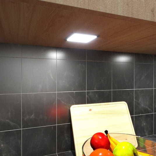 square slimline under cabinet light on a kitchen cabinet