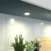 kitchen cabinet with surface mounted under cabinet light in warm white light